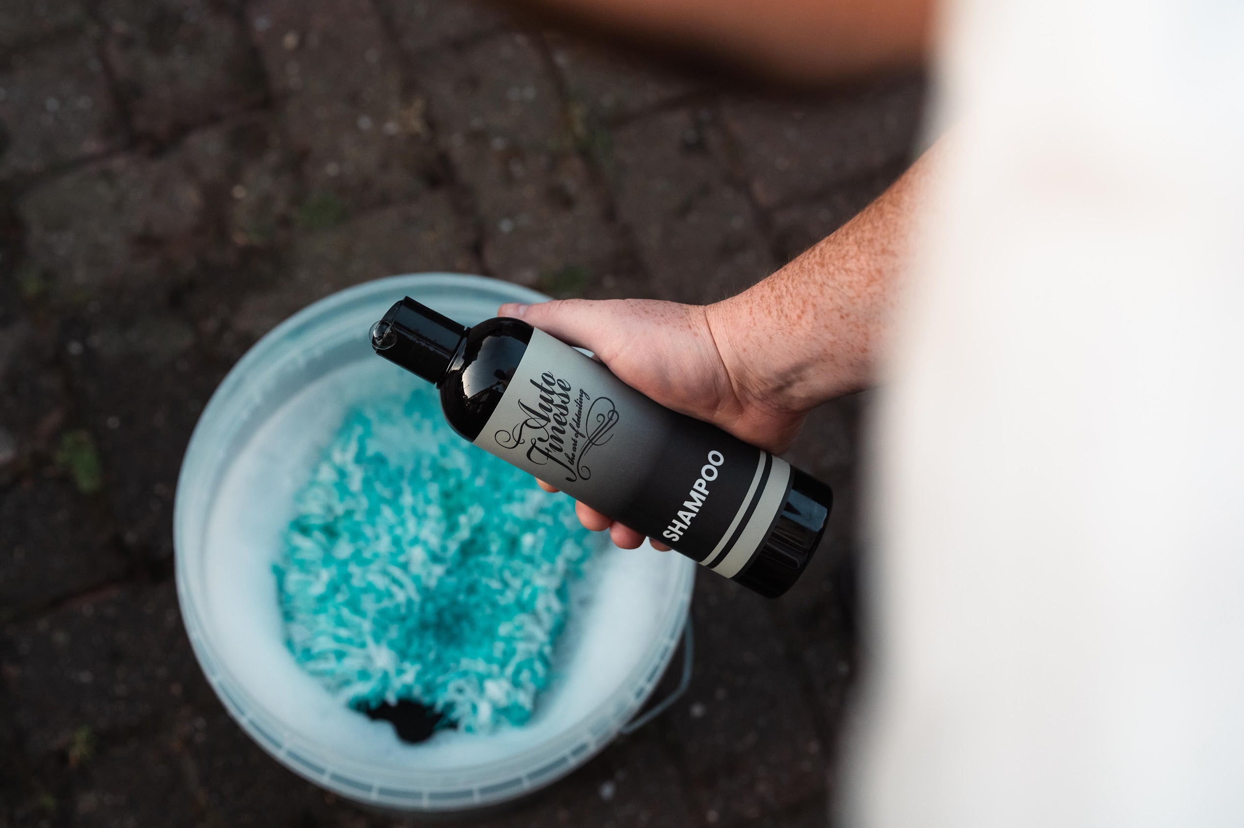 Essentials-Car-Shampoo-Into-Bucket